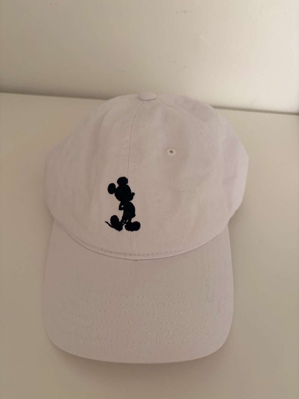 White and navy/black Mickey baseball hat